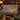 Pheasant Hedgerow Harvest woven blanket draped over a sofa or armchair