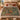 Pomegranate Hoopoes botanical woven blanket spread across a bed