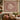 Pomegranate Vine Courtyard botanical woven blanket shown without a name as a wall tapestry