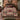 Rose Log Cabin botanical woven blanket spread across a bed
