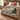 Rosehip Cat Cameos botanical woven blanket spread across a bed