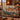 Rowan Waxwings woven blanket draped over a sofa or armchair