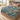 Sea Holly Branching Field botanical woven blanket spread across a bed