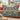 Sea Thrift Puffin Cliff woven blanket draped over a sofa or armchair