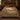 Shepherds Oak botanical woven blanket spread across a bed