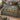 Skep Garden botanical woven blanket spread across a bed