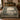 Swan Moat Chateau botanical woven blanket spread across a bed