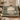 Swan Moat Chateau woven blanket draped over a sofa or armchair