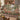 Terracotta Garden River woven blanket draped over a sofa or armchair