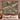 The Cardoon Bed woven blanket draped over a sofa or armchair