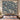 The Sea Holly Mound woven blanket draped over a sofa or armchair