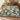 Trillium Waterfall Glen botanical woven blanket spread across a bed