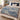 Tulip Rill botanical woven blanket spread across a bed