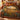 Twin Pointers Flint Hills Quail botanical woven blanket spread across a bed