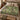Walnut Shade botanical woven blanket spread across a bed