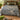 Willow Brook Kingfisher botanical woven blanket spread across a bed