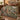 Willow Stream Foxglove botanical woven blanket spread across a bed