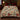 Poinsettia Deer & Cardinal Christmas woven blanket spread across a bed like a bedspread