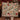 Couple holding a personalized Poinsettia Deer & Cardinal Christmas woven blanket with custom family name