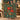 Couple holding a personalized Poinsettia Harvest woven blanket with custom family name woven in