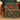 Poinsettia Harvest woven blanket draped over a sofa