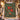Poinsettia Harvest woven blanket displayed outdoors on a snowy Christmas porch