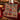 Poinsettia Legend Patchwork woven blanket with custom family name, room view