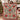 Couple holding a personalized poinsettia vase woven blanket with custom family name woven in