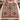 Poinsettia vase woven blanket spread across a bed