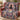 Pumpkin Stack Black Cat woven blanket draped over a sofa