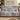 Personalized The Unhurried Chapter blue toile woven blanket draped over a taupe sofa
