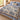 Personalized The Unhurried Chapter blue toile woven blanket laid across a white bed