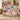 Personalized The Unwritten Alibi mystery clue woven blanket held open in a bright living room