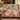 Personalized The Unwritten Alibi mystery clue woven blanket draped over a green velvet sofa