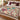 Personalized The Unwritten Alibi mystery clue woven blanket laid across a white bed