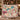 Personalized The Unwritten Alibi mystery clue woven blanket held up by a couple indoors