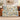 Dad's Brightest Stars woven blanket with Lily, Mason and Sophie on blue-and-ivory ornamental star and floral artwork, spread across a cognac sofa viewed from the front.