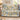 Dad's Brightest Stars woven blanket with Lily, Mason and Sophie on blue-and-ivory ornamental star and floral artwork, draped on a sofa.