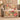 Our Life in Bloom woven blanket with Laura & James and October 12, 2014, framed by pink camellias and cream honeysuckle on a blush background, spread across a taupe sofa viewed from the front.