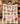 Minnie Mouse & Mickey Sweethearts personalized fleece blanket held up in a cozy living room