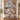 Personalized Schnauzer Nordic Christmas Village quilt hung on a wooden rod above a bench with 2 pillow shams