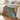 Personalized High Country Trout fishing woven blanket spread across a bed