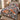Winter Fox Hellebore quilt bedding set on a wooden bed in a bright bedroom