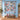 Personalized Snowlight Canopy snowman quilt with sample family name hung on a wall above a bench with 2 matching pillowcases