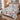 Snowlight Canopy snowman quilt bedding set with 2 matching pillowcases on a bed beside a snowy window
