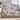 Snowlight Canopy snowman woven blanket draped over a sofa by a snowy window