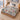 Snowlight Canopy snowman Christmas woven blanket spread across a bed in a winter bedroom