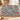 Ornamented Winter Stags Nordic Christmas woven blanket draped over a white sofa