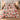 Yuletide Keepsake Patchwork comforter bedding set in pink with 2 matching pillowcases on a bed