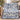 Personalized Yuletide Keepsake Patchwork woven blanket in blue draped on a sofa with sample family name The Thompsons above the toy train